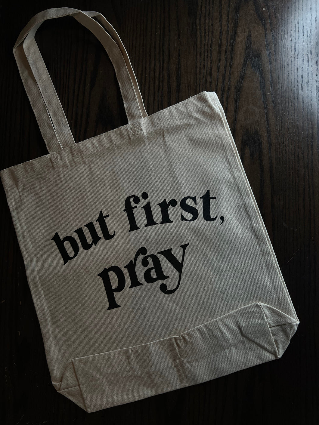 But first, pray tote bag